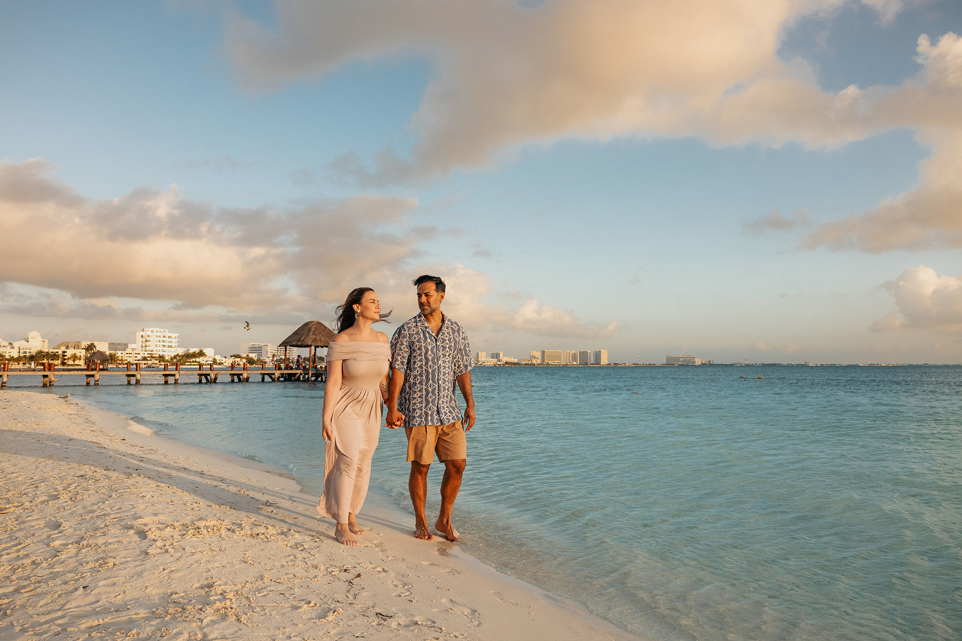 Couple on the beach in front of Amàre Cancún